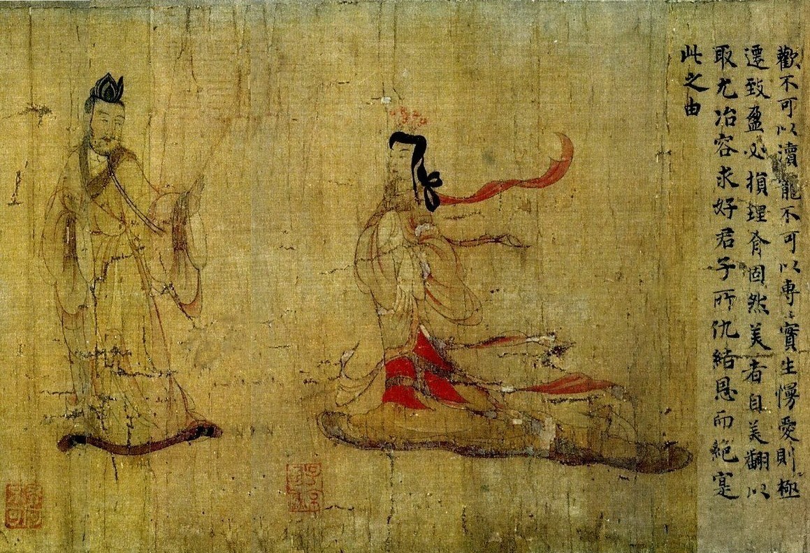figure of a man in robes and a woman in robes along with Chinese calligraphy on textured paper with red stamp marks